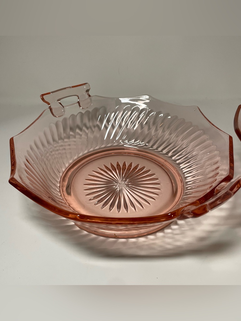 Sunburst pink glass depression bowl with handles